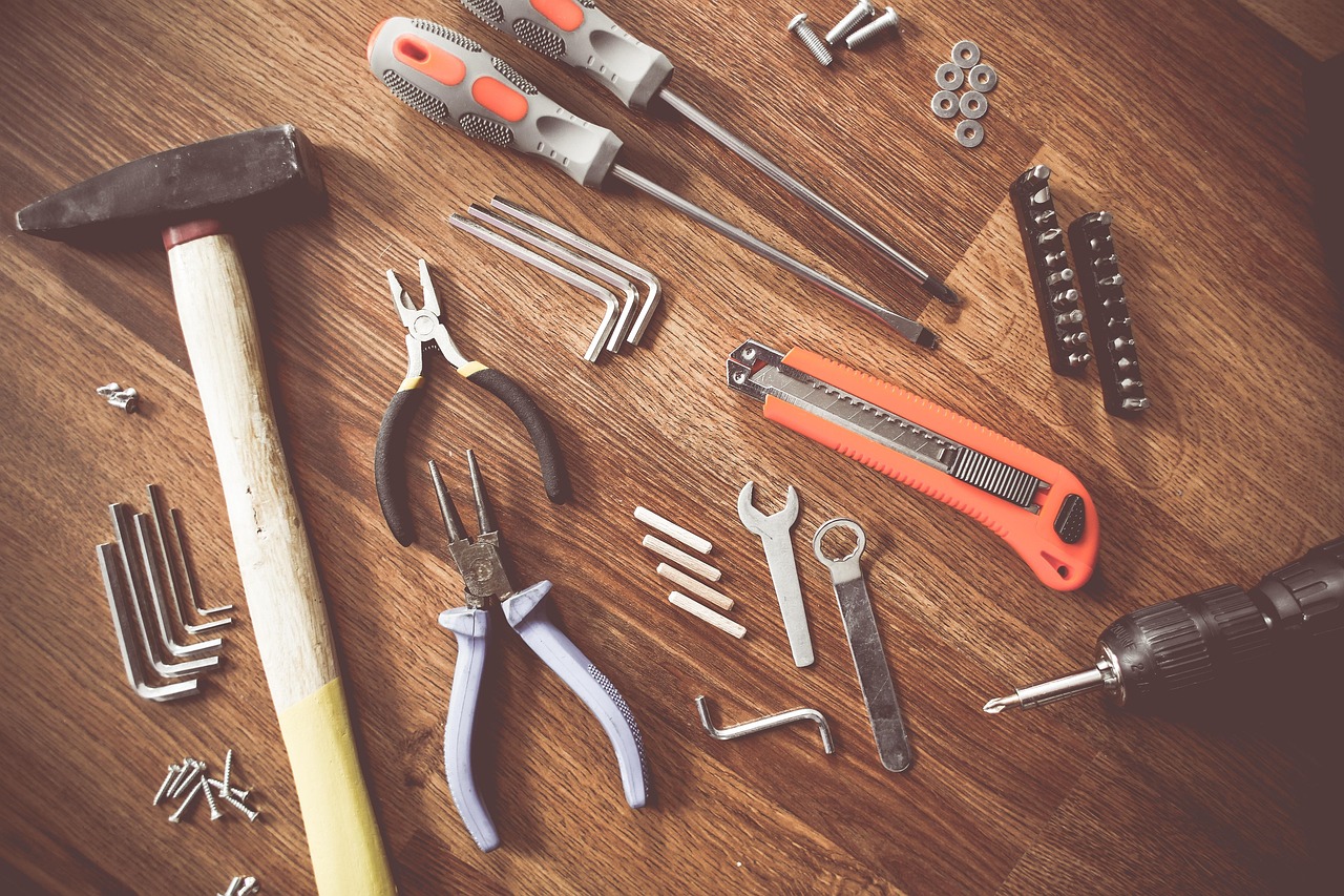 Flatlay of hand tools on a work table